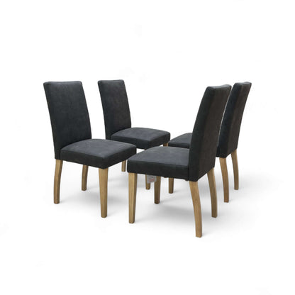 Set of five black upholstered chairs with wooden legs on a white background