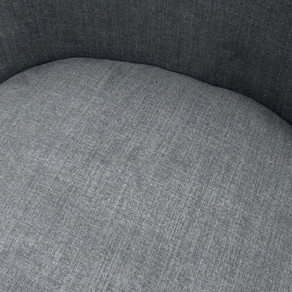 Close-up of a gray upholstered chair seat with a textured fabric finish.