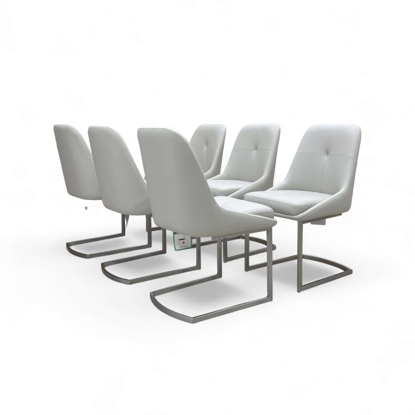 Set of six modern gray chairs with metal legs on a white background