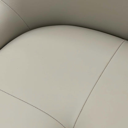 Close-up of beige chair seat leather with stitching details