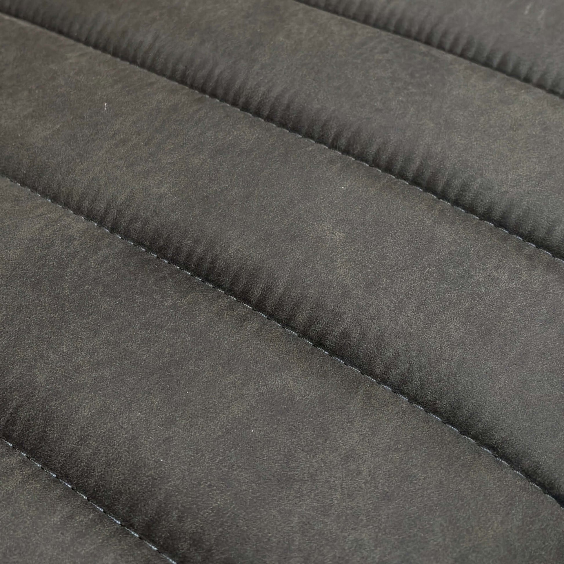 Close-up of a textured Gray fabric surface of a dining bench.