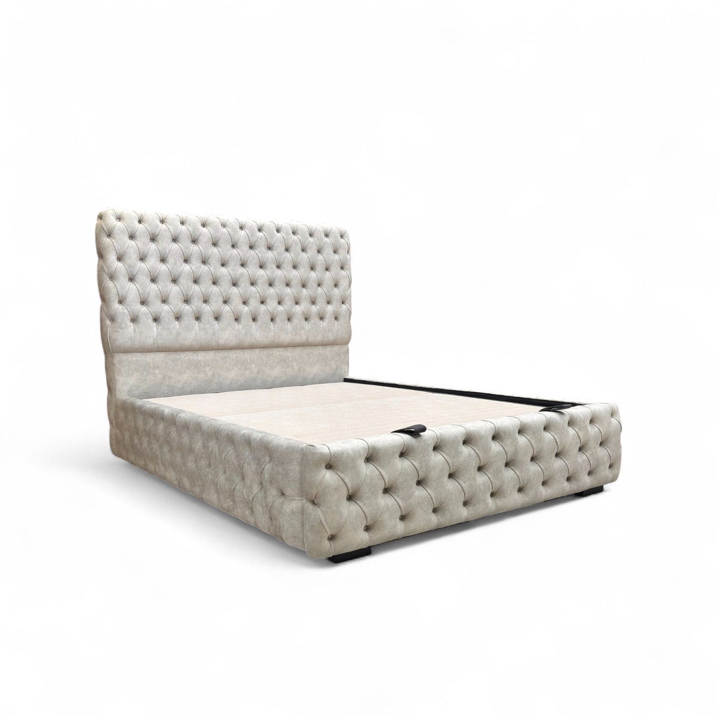 Side profile view of the Belford velvet bed, showing the full height of the floor-standing headboard and the streamlined base.