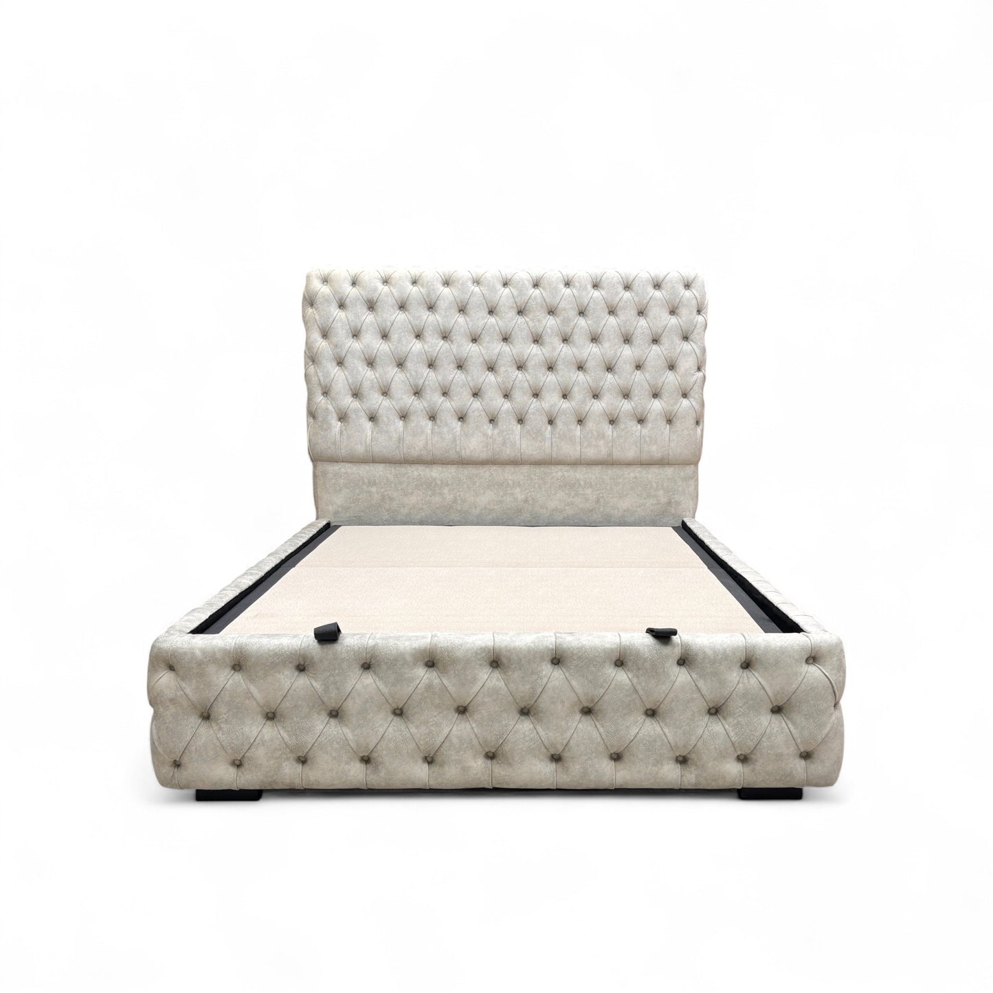 Belford Dapple Oyster Velvet King Size Bed with a tall, floor-standing headboard and end-lift ottoman storage, styled with decorative pillows.