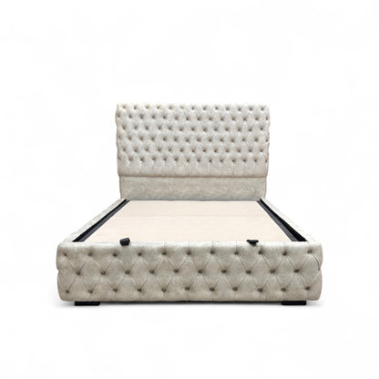 Belford Dapple Oyster Velvet King Size Bed with a tall, floor-standing headboard and end-lift ottoman storage, styled with decorative pillows.