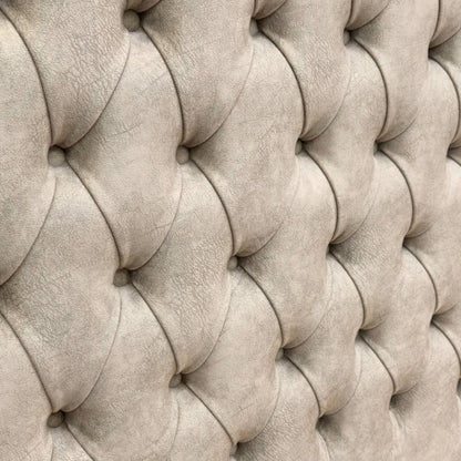 Close-up detail of the soft Dapple Oyster velvet upholstery and button-tufted stitching on the tall headboard.
