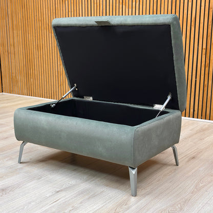 View of the storage footstool with the lid open, showcasing the spacious internal compartment.
