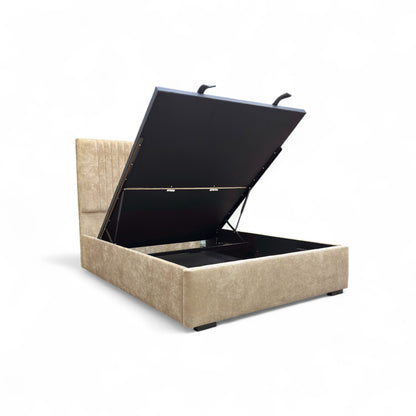 Beige storage bed with black lift-up lid on a white background
