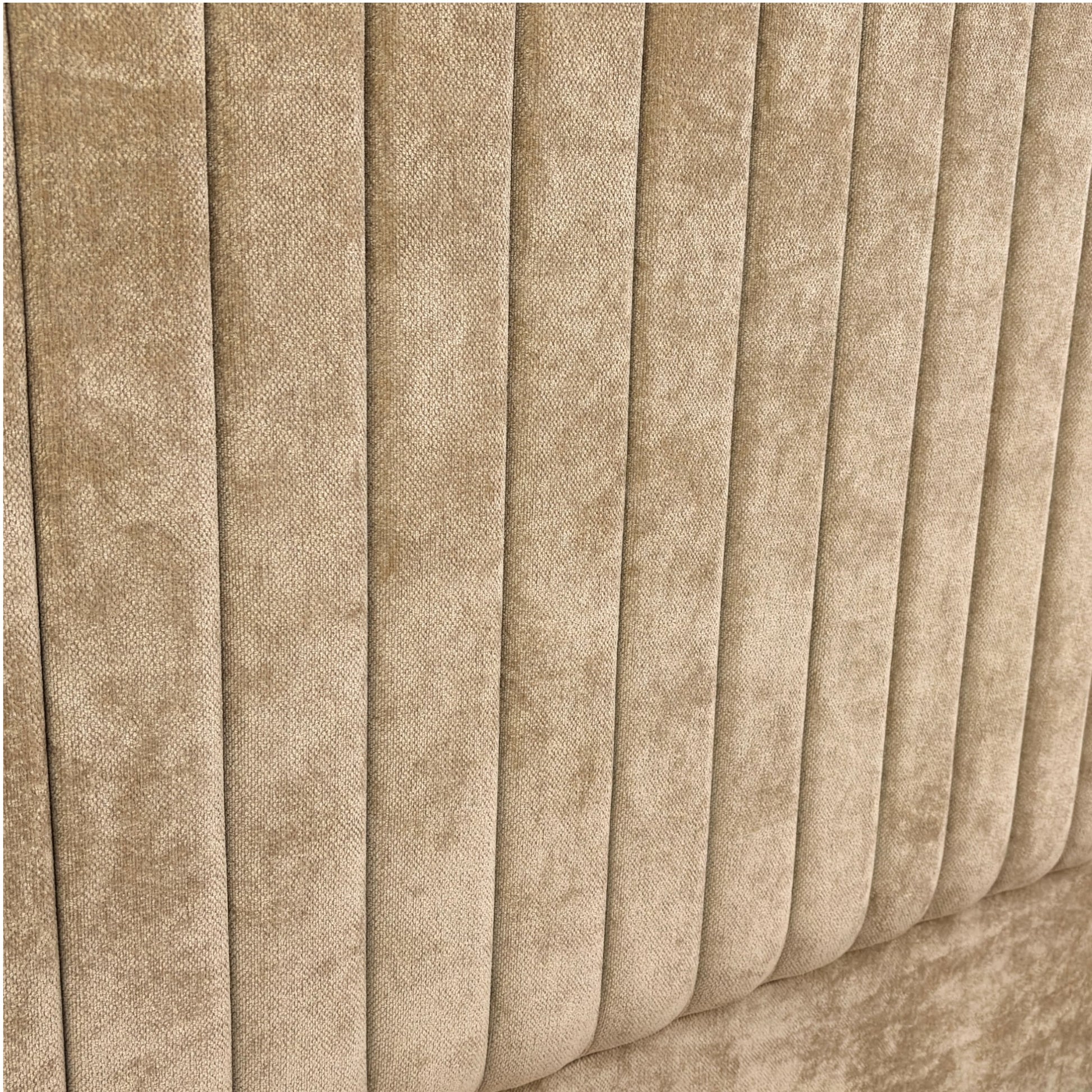 Close-up of pleated beige fabric texture