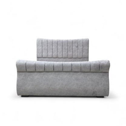 Gray upholstered headboard and footboard on a white background