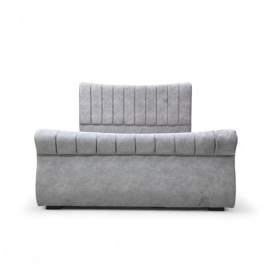 Gray upholstered headboard and footboard on a white background