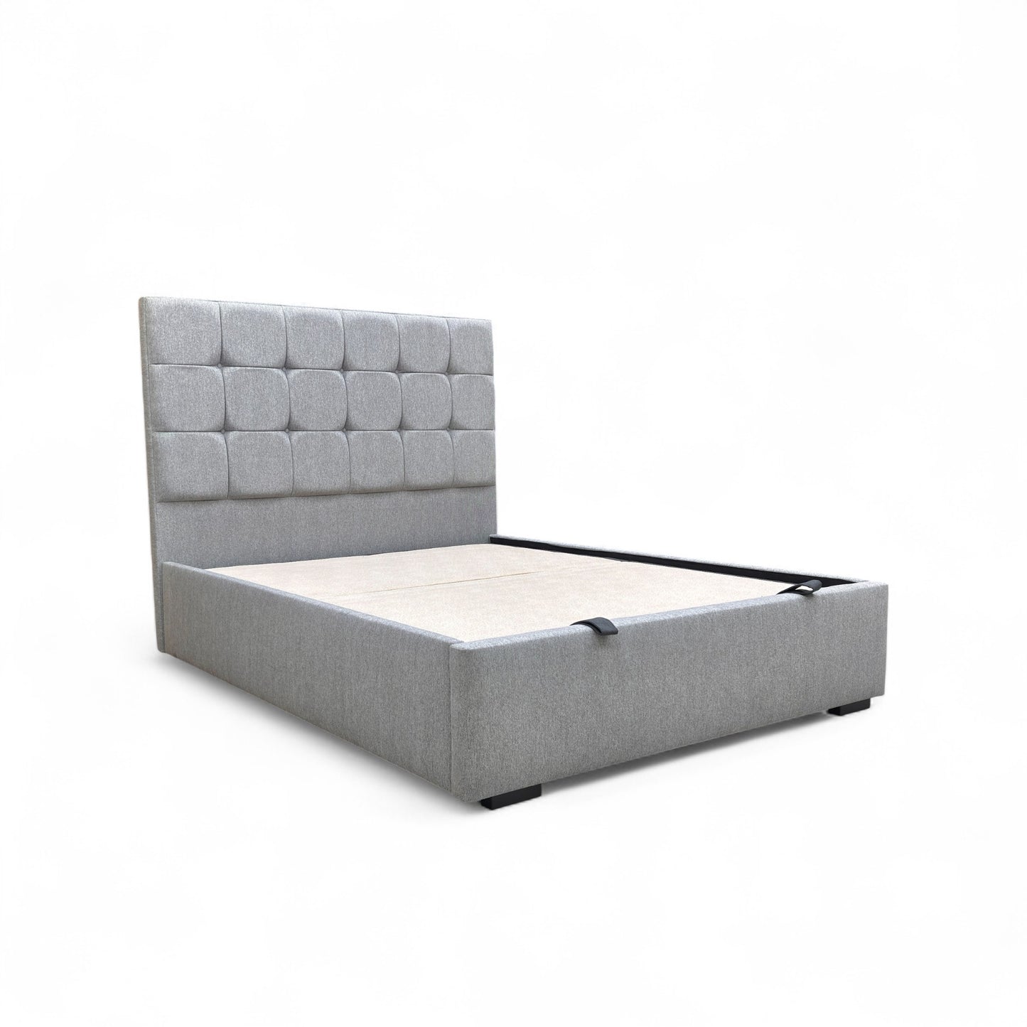 Side angle view of the Capricorn king bed, showcasing the profile of the floor-standing headboard and the clean lines of the upholstered base.