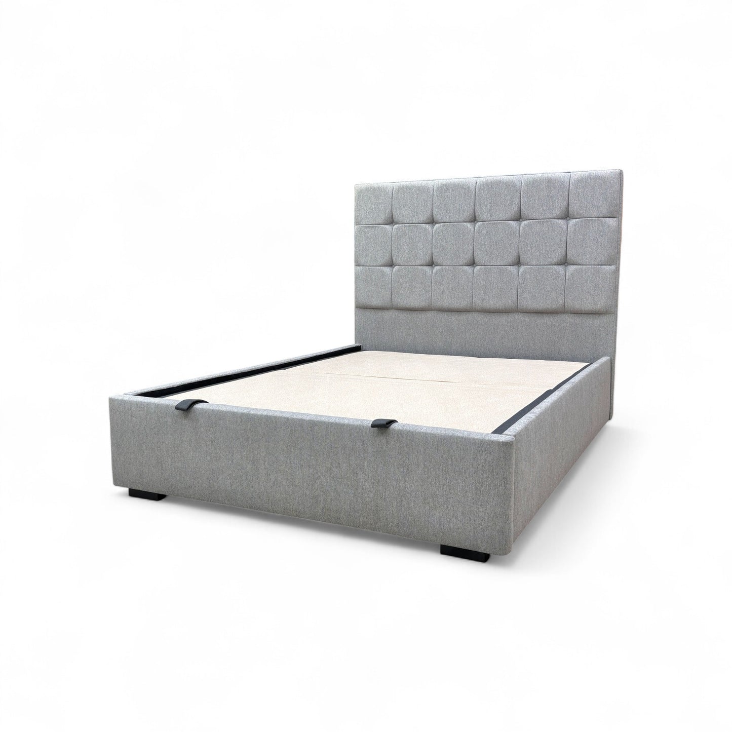 Side angle view of the Capricorn king bed, showcasing the profile of the floor-standing headboard and the clean lines of the upholstered base.