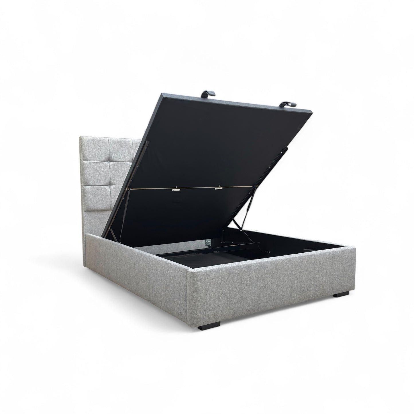 Demonstration of the end-lift ottoman storage mechanism, showing the bed base lifting easily at the foot of the bed to reveal spacious storage underneath.