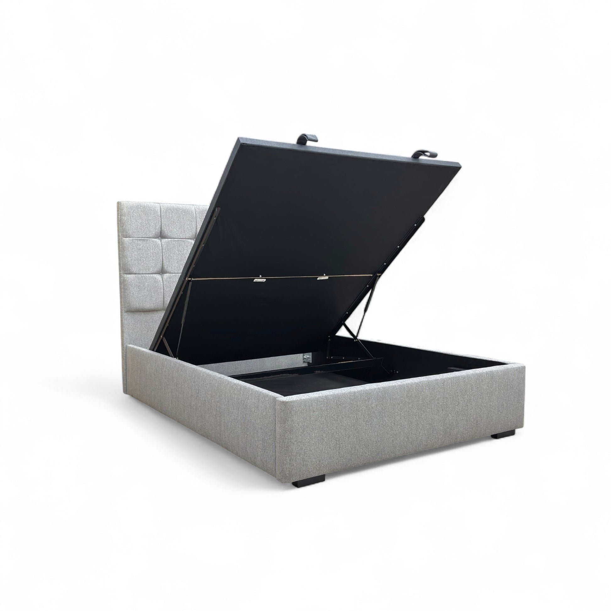 Demonstration of the end-lift ottoman storage mechanism, showing the bed base lifting easily at the foot of the bed to reveal spacious storage underneath.