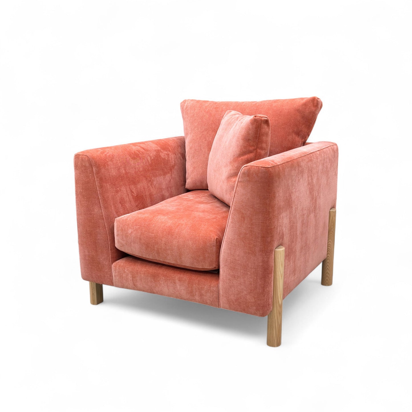 Orange armchair with cushions on a white background