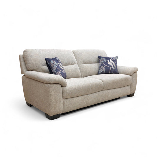 Beige sofa with decorative pillows on a white background