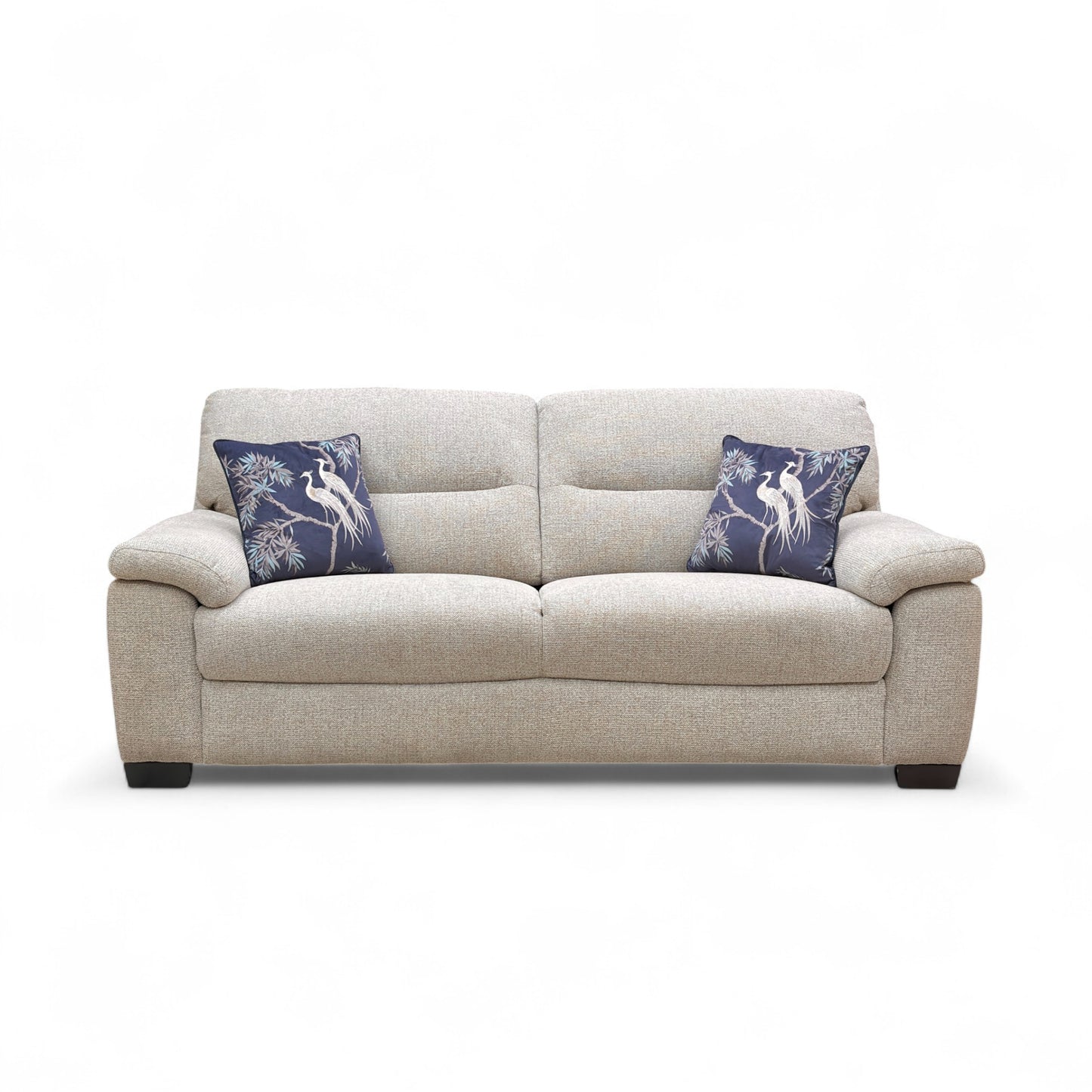 Beige sofa with blue pillows on a white background