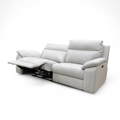 Angled view of the sofa with the footrests partially reclined, showing an intermediate relaxation position.