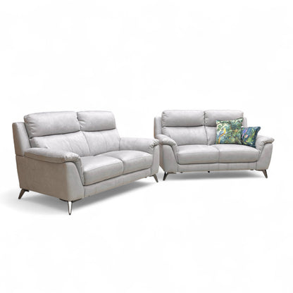 Full angled front view of the Contempo Bluish Grey Suede Fabric 2+2 Seater Sofa Set, showing both identical 2-seater sofas in a modern living space.