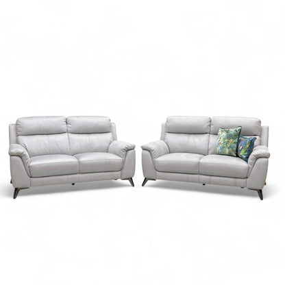Straight-on view of one of the Bluish Grey Contempo 2-seater sofas, highlighting the contemporary shape and high back cushions.