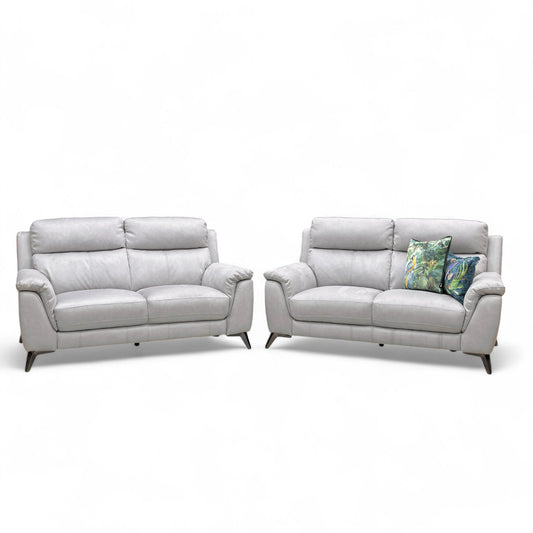Straight-on view of one of the Bluish Grey Contempo 2-seater sofas, highlighting the contemporary shape and high back cushions.