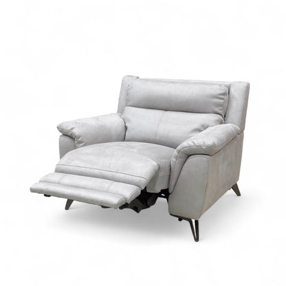 Side profile view of the recliner armchair, emphasizing the high back and plush armrest shape.