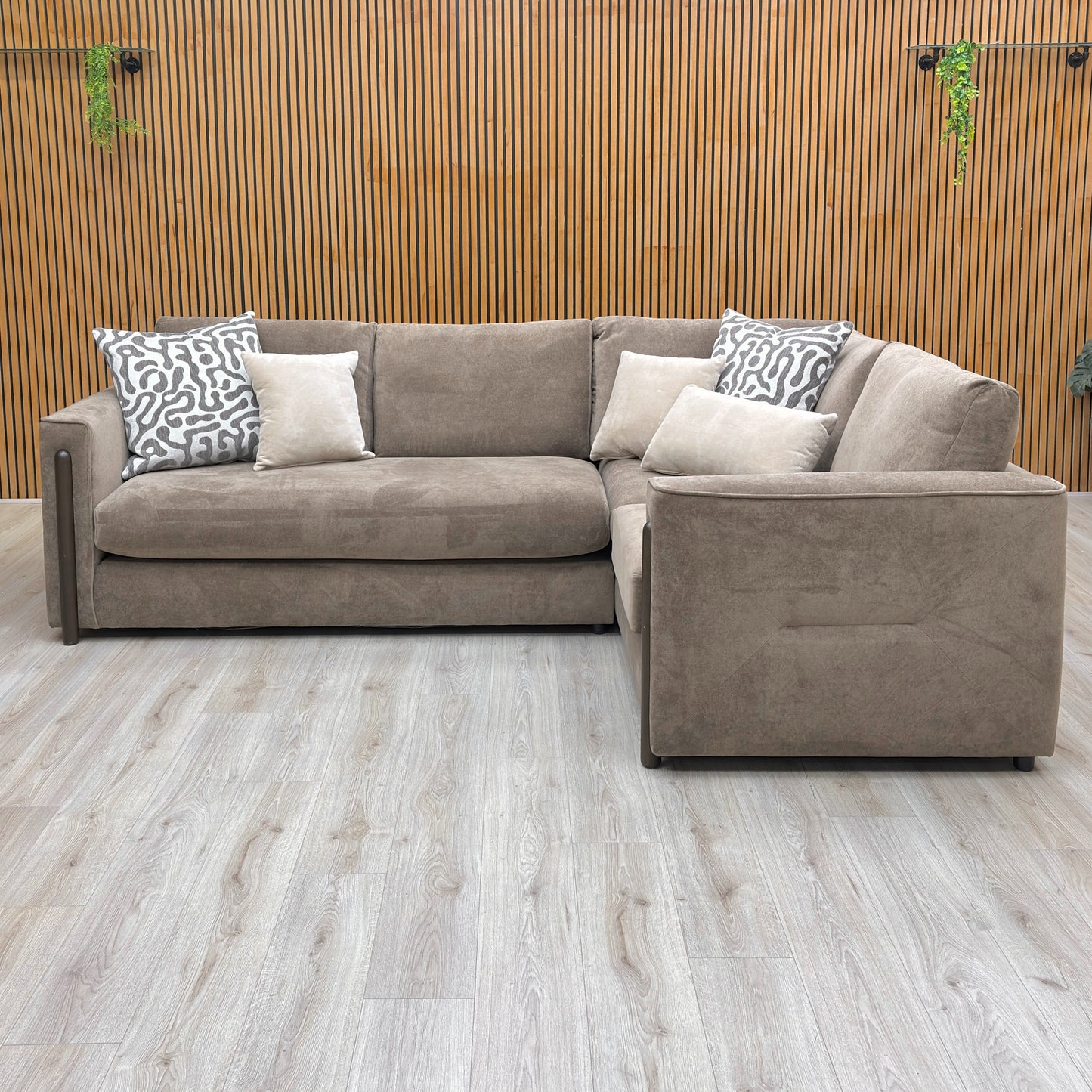 Lifestyle shot of the ‘Barney’ corner sofa in a contemporary living room setting, emphasizing its sophisticated silhouette.