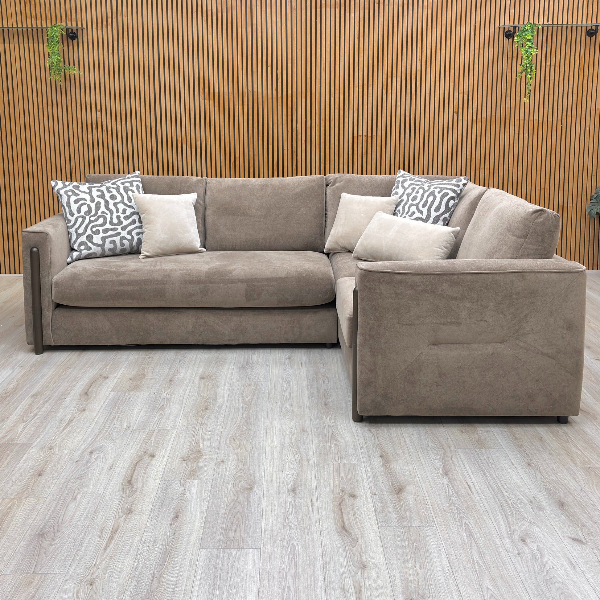 Lifestyle shot of the ‘Barney’ corner sofa in a contemporary living room setting, emphasizing its sophisticated silhouette.