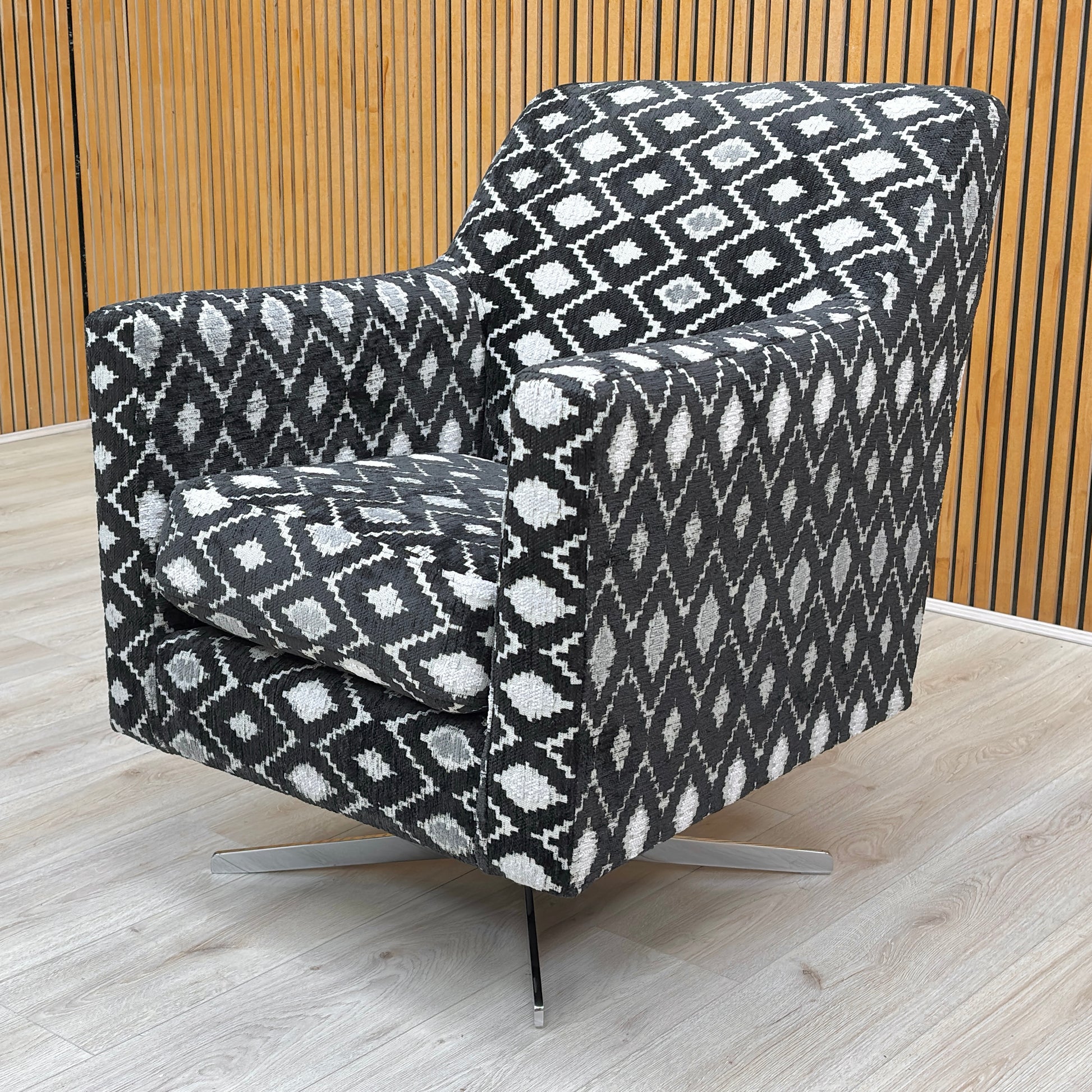 lifestyle image showcasing the ‘Vera’ diamond pattern swivel chair in a modern living room.