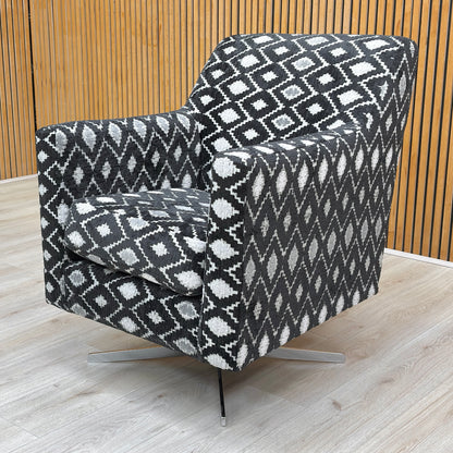 lifestyle image showcasing the ‘Vera’ diamond pattern swivel chair in a modern living room.