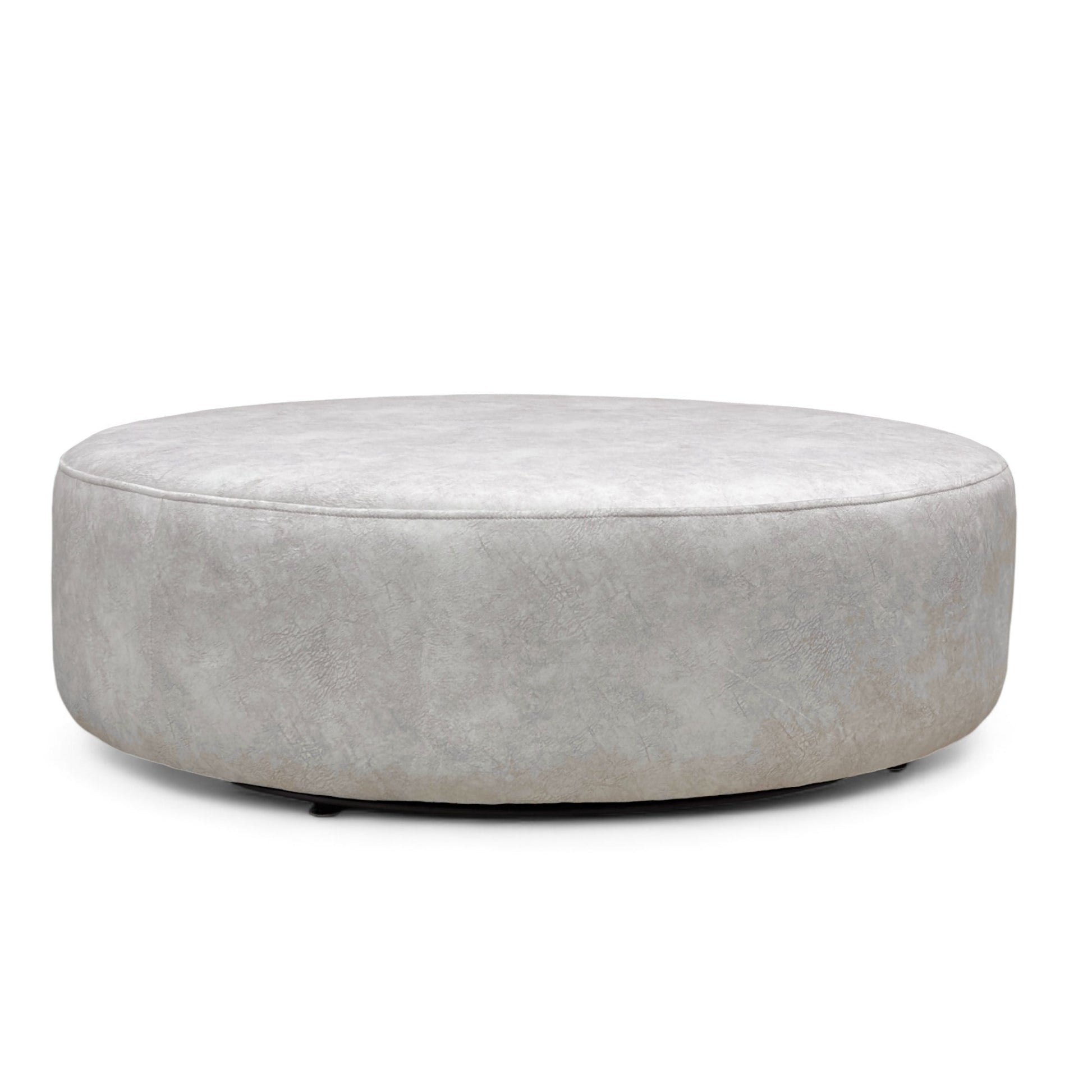 Side view of the round twister footstool, emphasizing its low-profile height and substantial build with the swivel base visible underneath