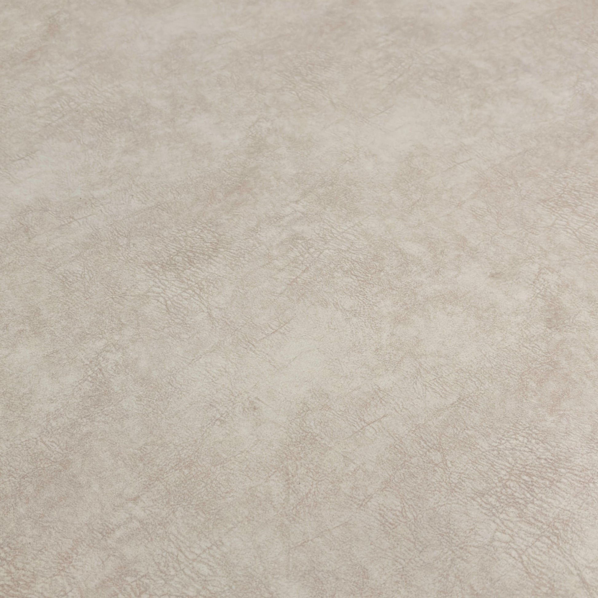 Close-up of the patterned top cushion of the footstool, showing the fabric detail and contrasting color.