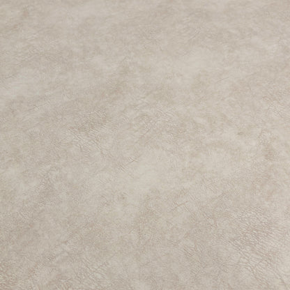 Close-up of the patterned top cushion of the footstool, showing the fabric detail and contrasting color.