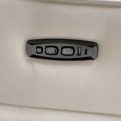 Close-up of the power headrest mechanism in the upright position, demonstrating the high-back support