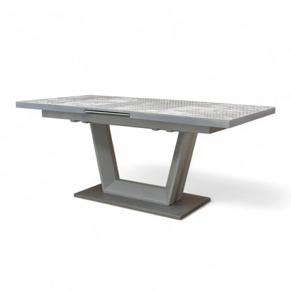 Full view of the Grigio dining table fully extended (to 216 cm), showing the expanded seating capacity for up to 10 people.