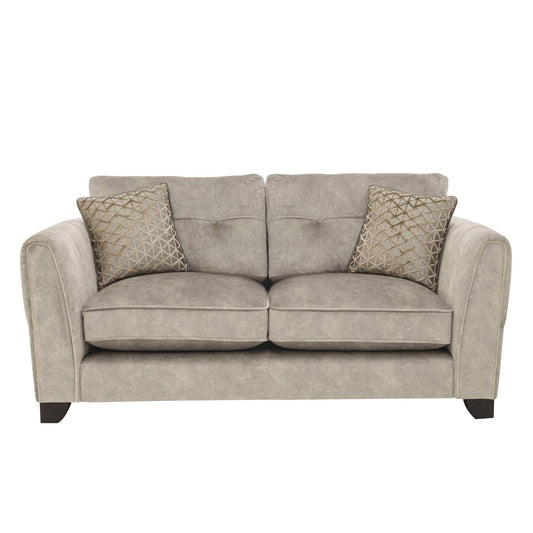 The Mariah Ariana Classic 2-seater sofa in Dapple Cream velvet, featuring elegant vertical channel tufting and distinctive brass inserts.