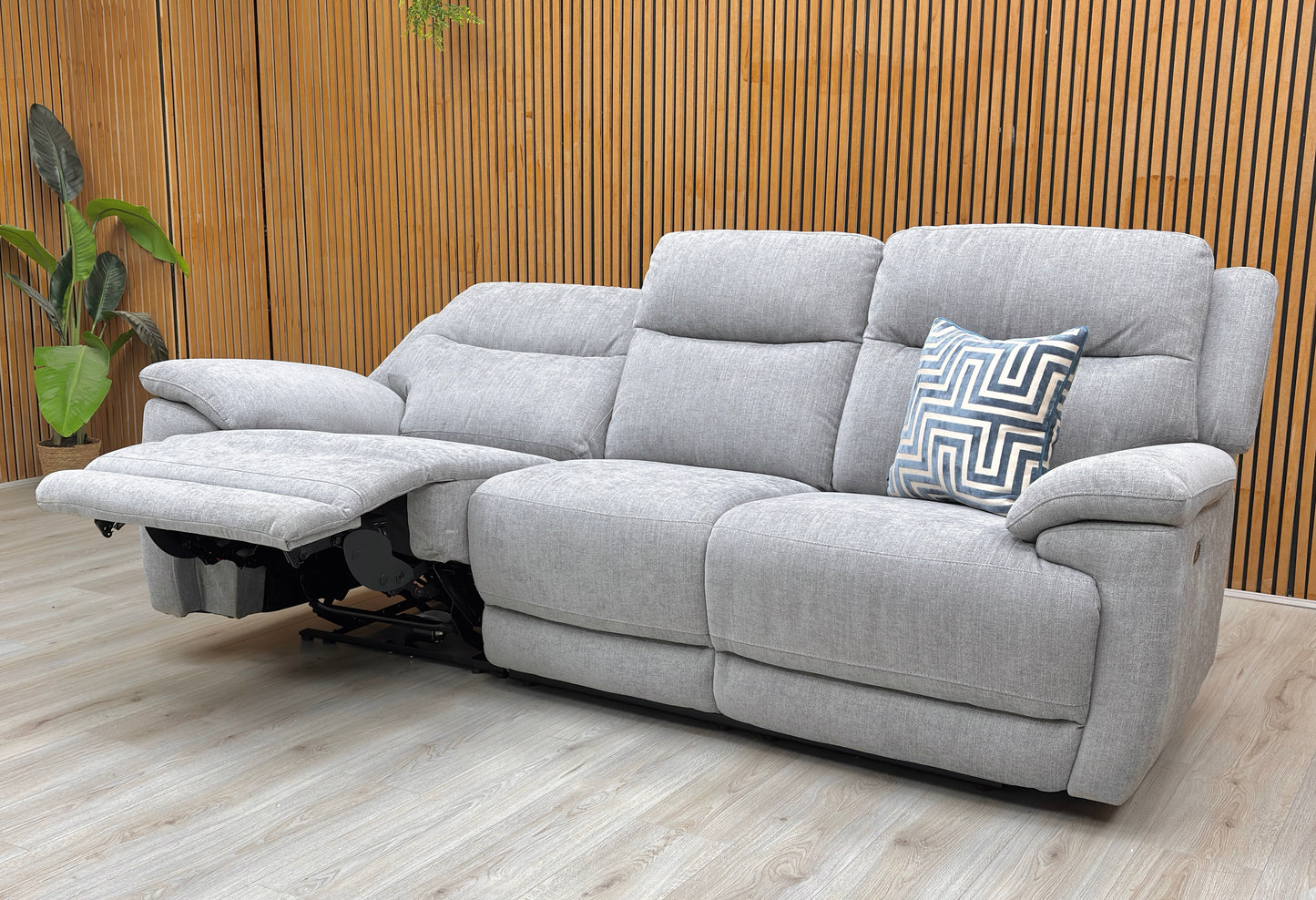 Living room view of the Touch sofa, showcasing the plush high-density foam cushions and the soft-touch textured fabric in a sophisticated slate grey tone.