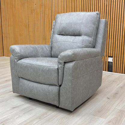 Life Style view of the 'Azzurri' manual recliner armchair in grey endurance fabric, showing its modern and plush design.