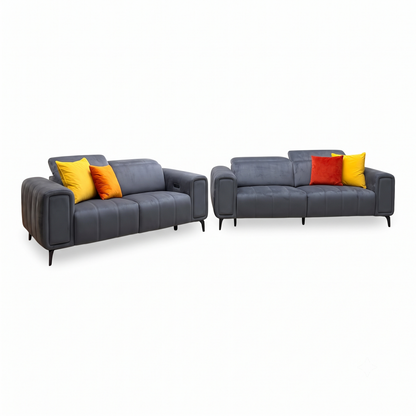 Elphaba granite grey velvet 3 + 2 seater power recliner sofa set upright, angled view with yellow and orange cushions