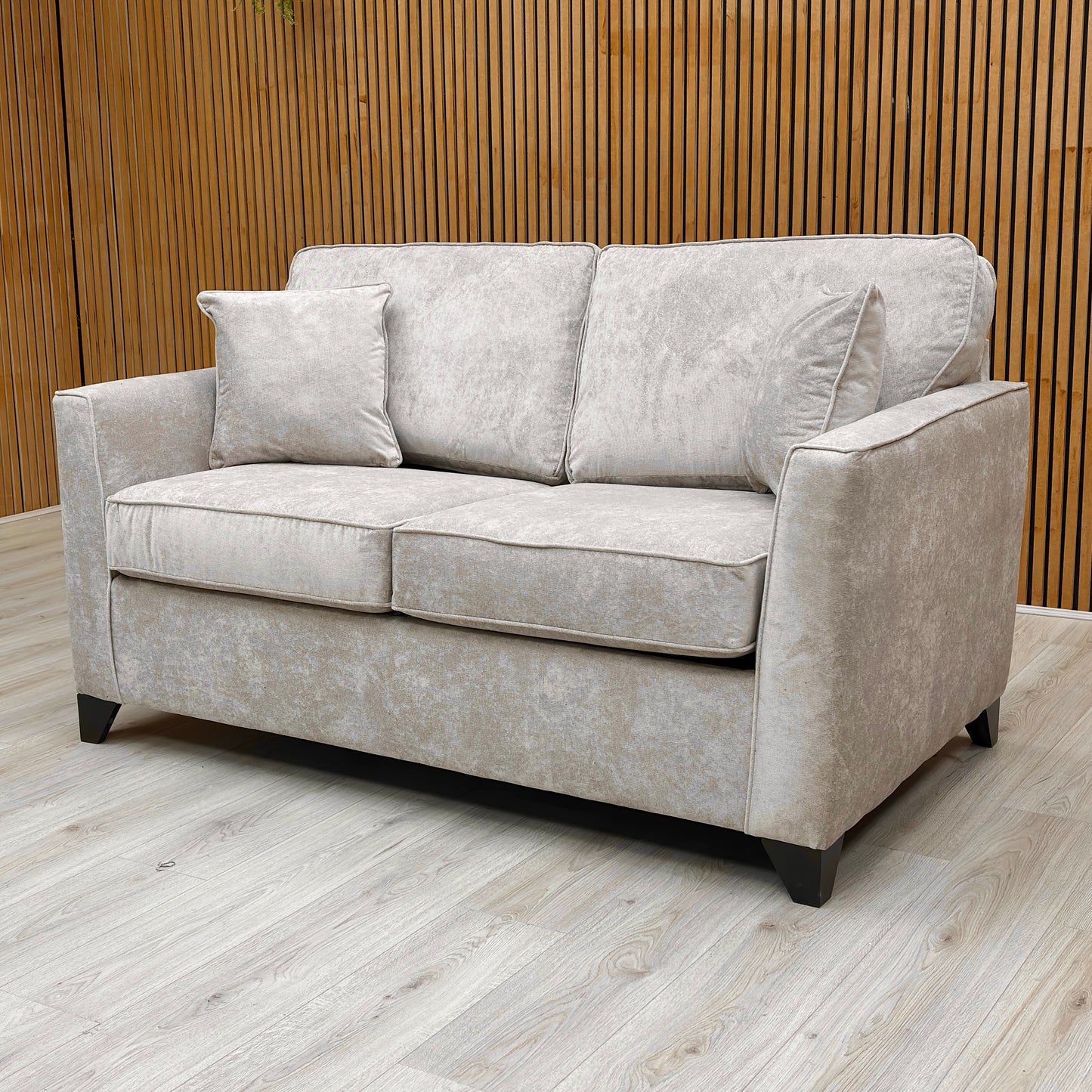 The ‘Smith’ Sofa Bed fully extended into the sleeping position, showing the pull-out metal frame and double-sized mattress.