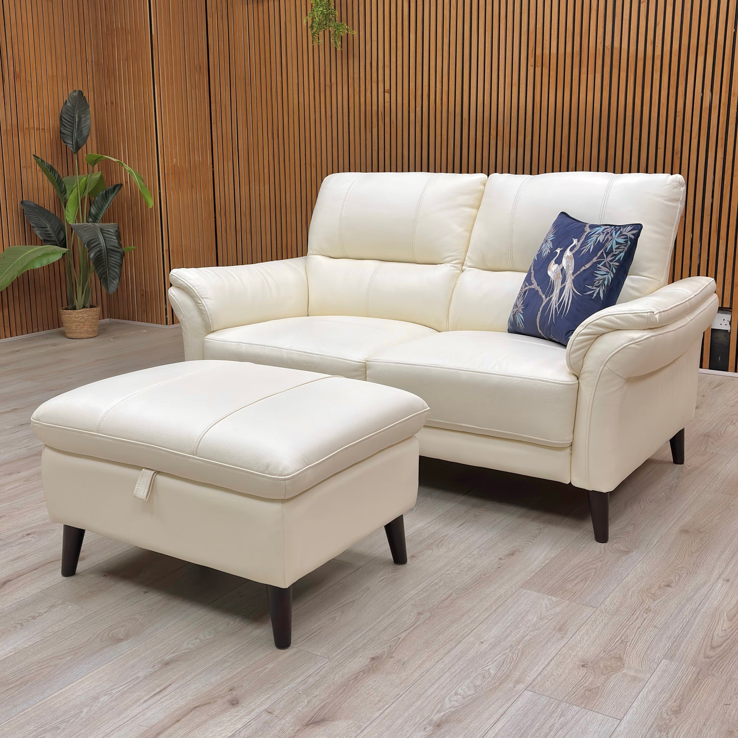 Rear angled view of the ‘Winner’ Oslo 2 Seater Sofa, emphasizing the high-quality cotton white leather and classic silhouette.