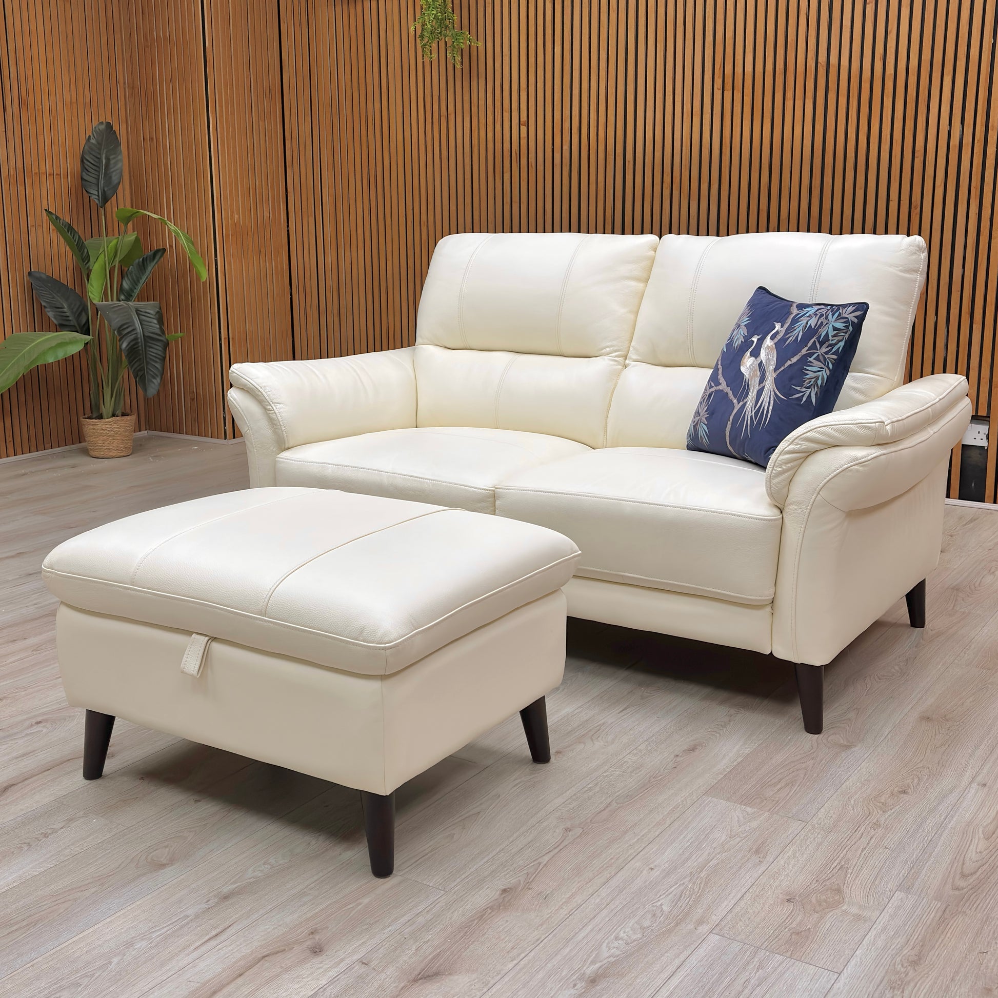 Rear angled view of the ‘Winner’ Oslo 2 Seater Sofa, emphasizing the high-quality cotton white leather and classic silhouette.