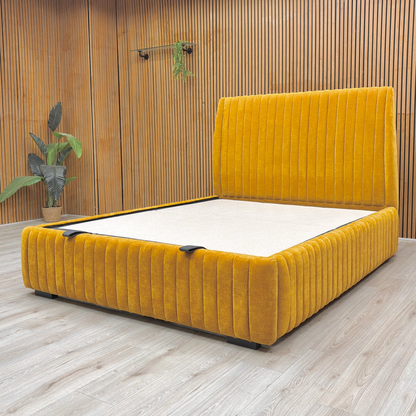 Lifestyle image of the King-size 'Aydon' bed in a bedroom, demonstrating its modern style and the color of the saffron fabric.