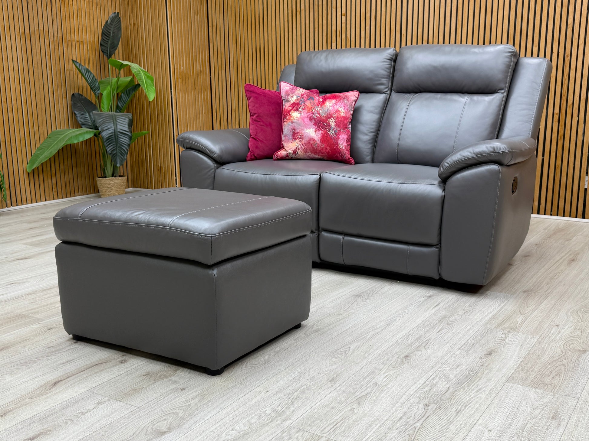 Side view of the 'Maverick' recliner sofa, showing the handle mechanism used to activate the manual recline function.
