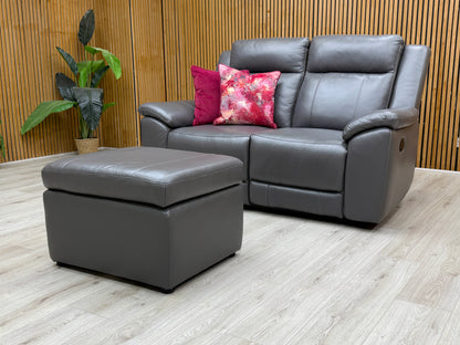 Side view of the 'Maverick' recliner sofa, showing the handle mechanism used to activate the manual recline function.