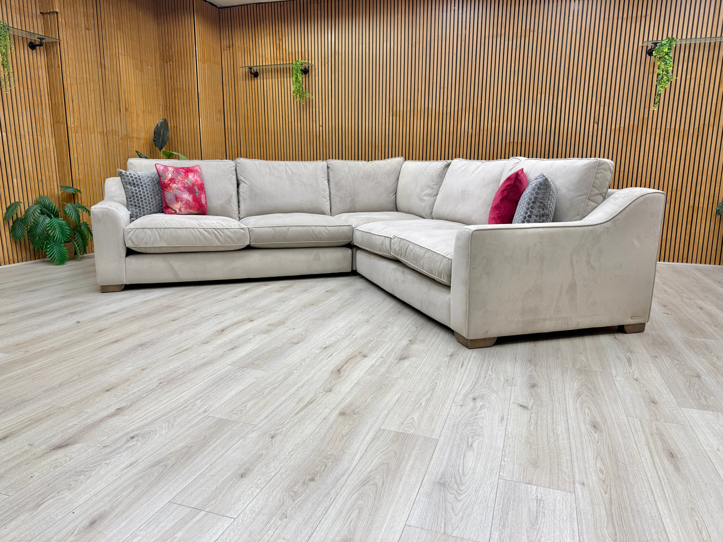 Side view of a section of the 'Isobel' sofa, illustrating the sofa's depth, low profile, and substantial armrests.