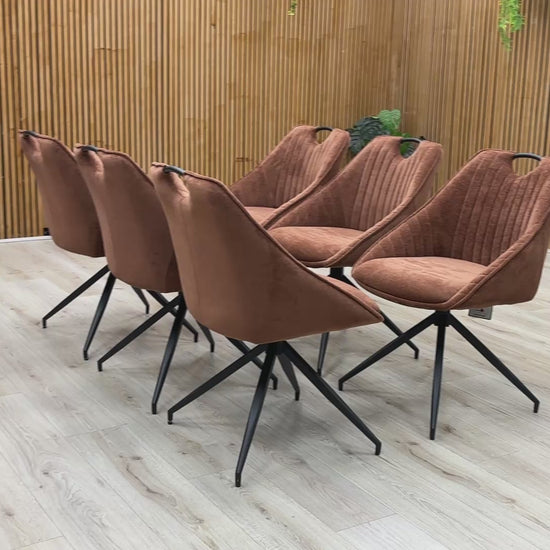 Product video tour of the Furniture Village ‘Jai’ Rust Orange Fabric Swivel Dining Chairs, demonstrating the smooth auto-return swivel mechanism, fabric durability, and overall structural stability.