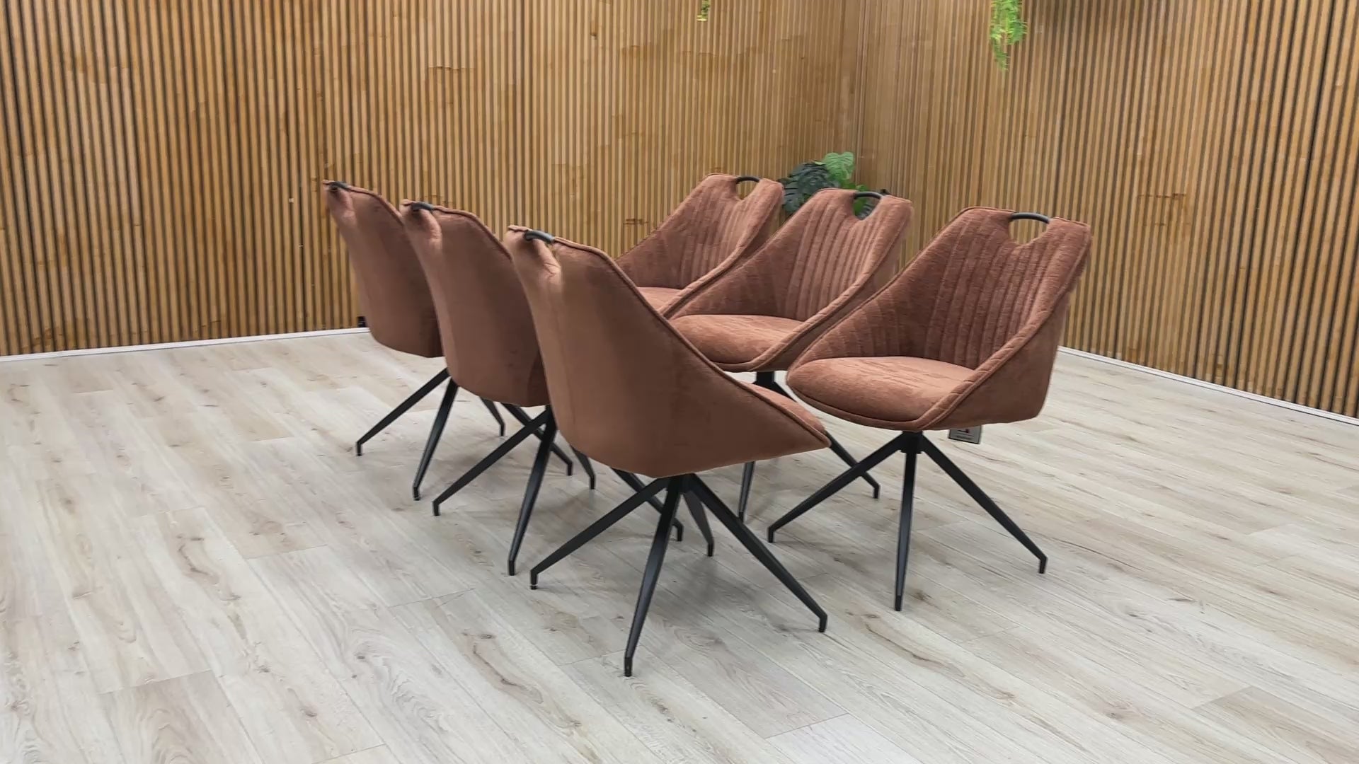 Product video tour of the Furniture Village ‘Jai’ Rust Orange Fabric Swivel Dining Chairs, demonstrating the smooth auto-return swivel mechanism, fabric durability, and overall structural stability.