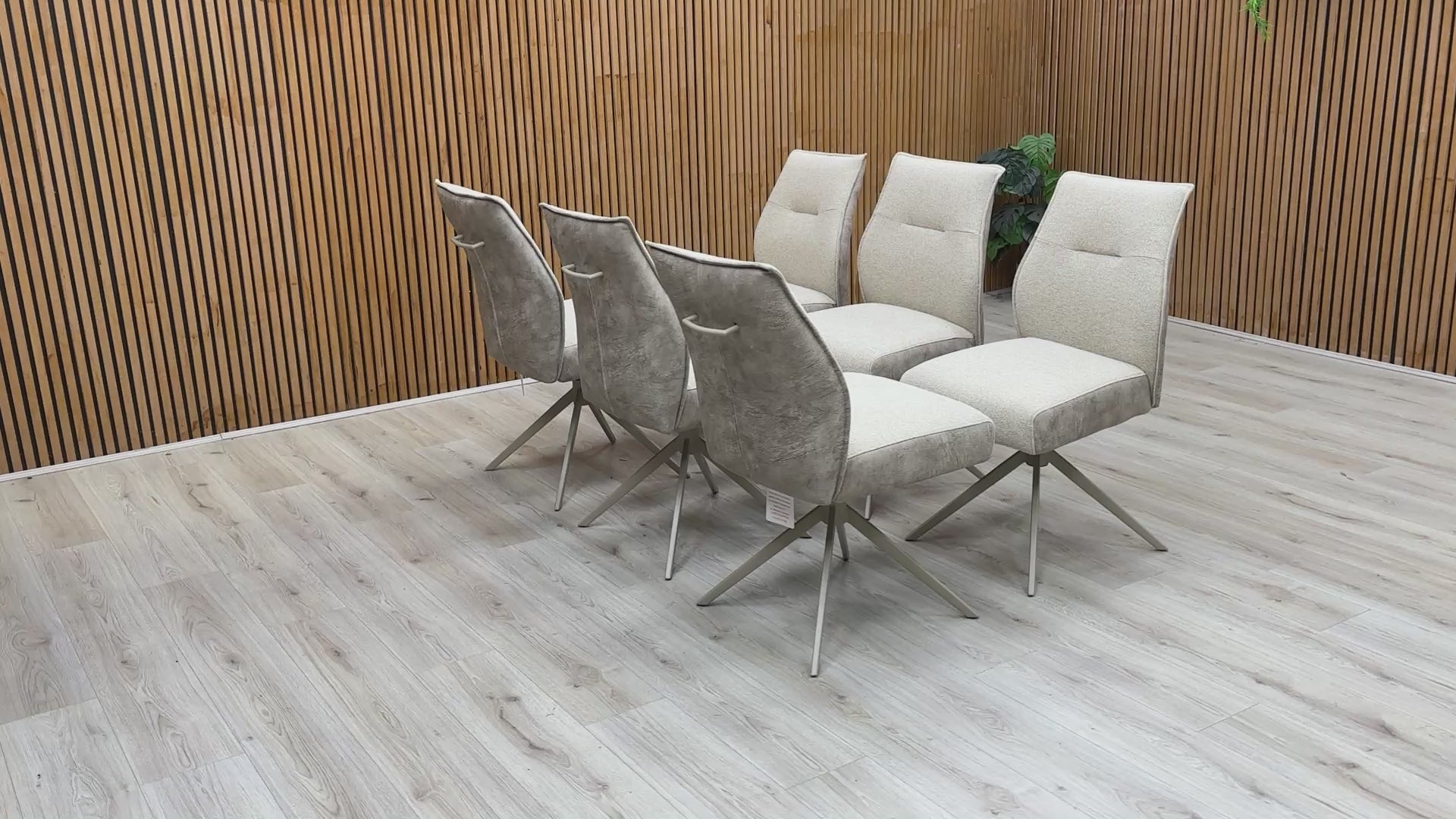 Product video tour of the ‘Mirage’ Neutral Swivel Dining Arm Chairs, demonstrating the smooth rotation mechanism and the high-quality fabric texture.