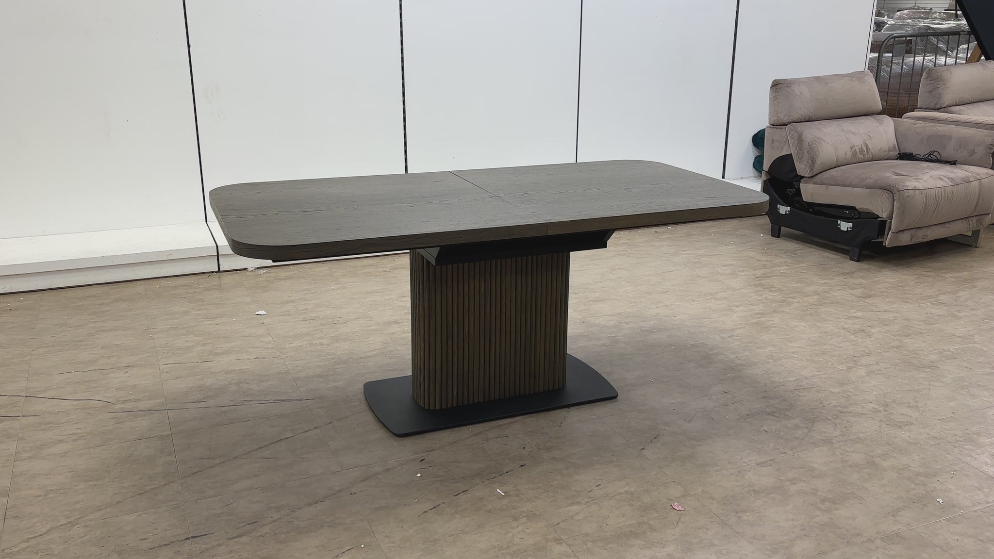 Video demonstration of the Jai dark oak dining table, showcasing the easy-to-use butterfly extension mechanism.